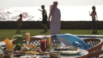 Dine al fresco in a relaxed atmosphere, surrounded by the soothing sounds of the pool.
