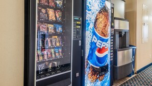 A vending machine with snacks and a Pepsi dispenser. - Quality Inn & Suites Eldridge Davenport North (Eldridge)