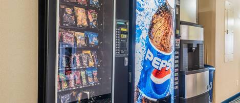 A vending machine with snacks and a Pepsi dispenser.