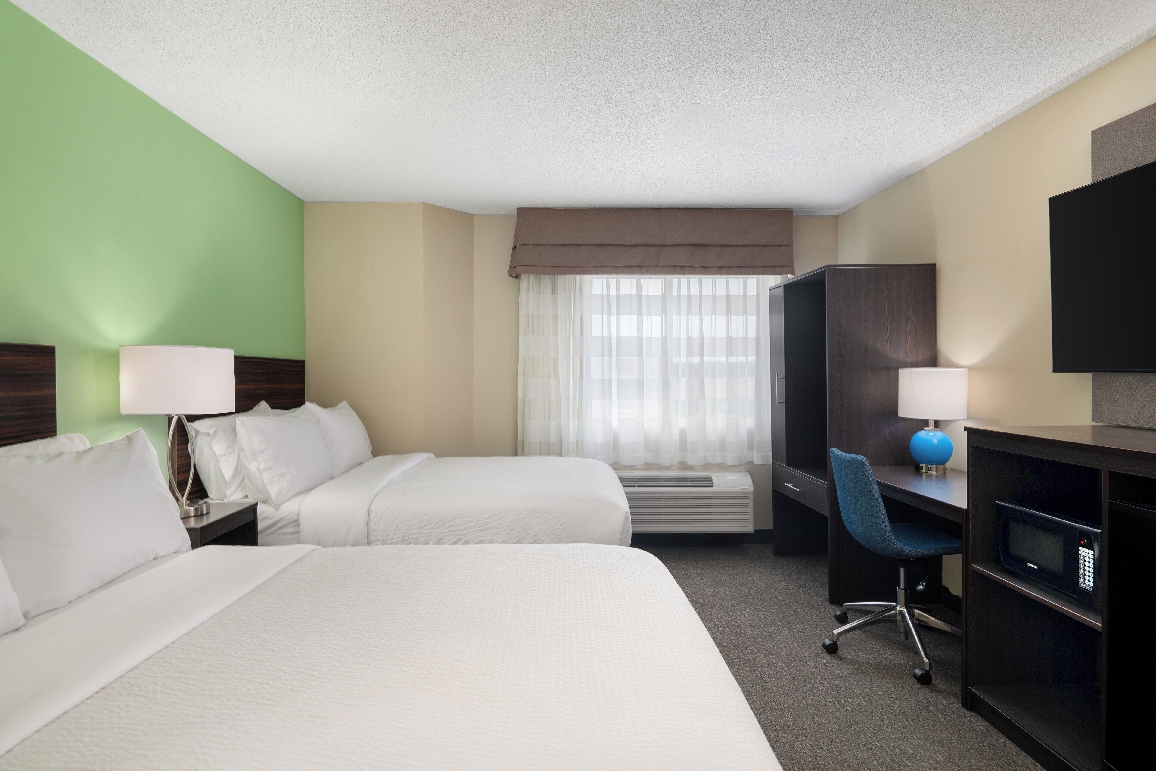 premium bedding, desk, laptop workspace, blackout curtains