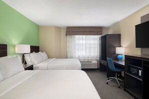 Premium bedding, desk, laptop workspace, blackout drapes