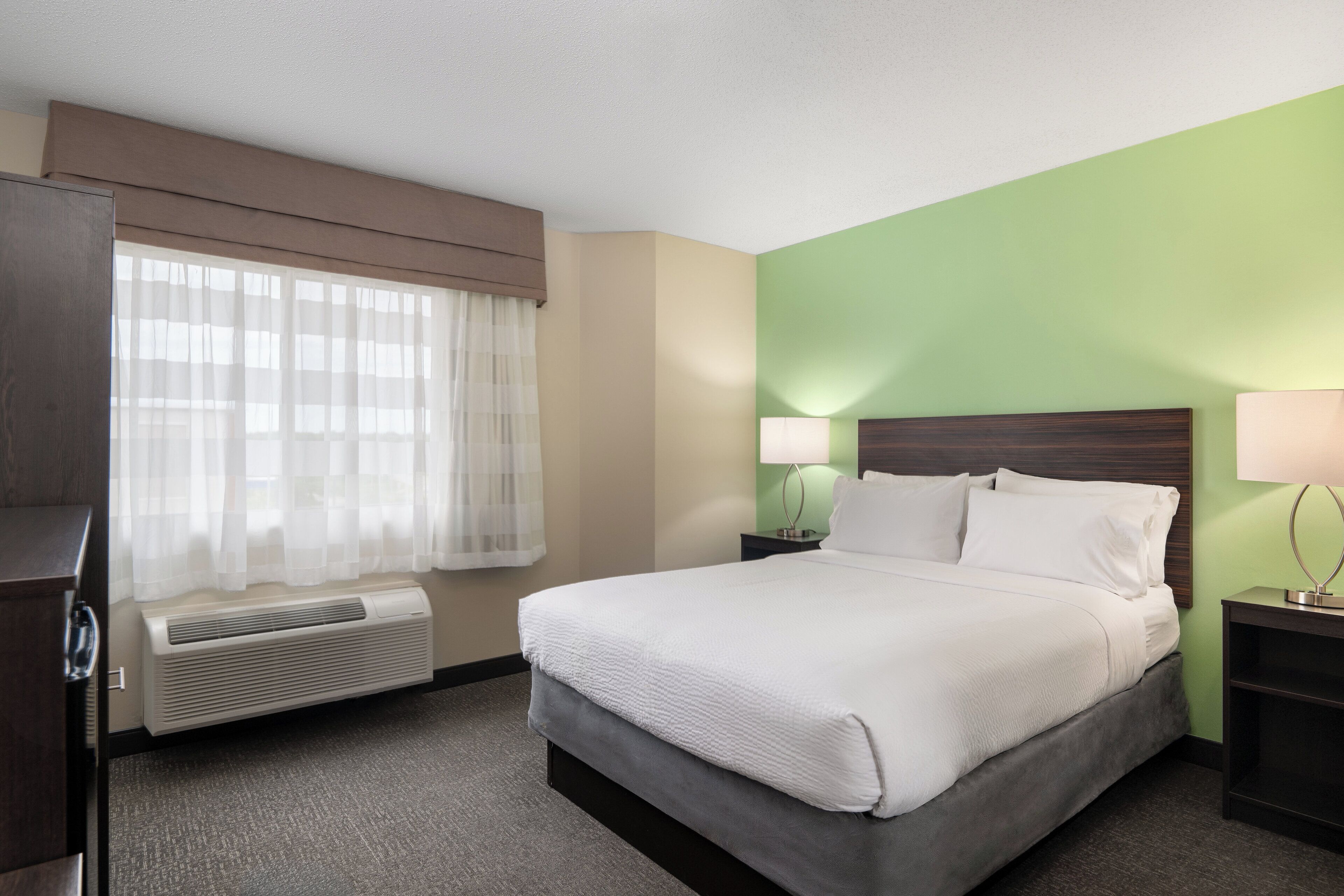 premium bedding, desk, laptop workspace, blackout curtains