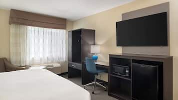 Premium bedding, desk, laptop workspace, blackout drapes