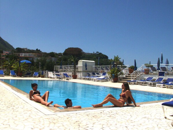 Indoor pool, outdoor pool, open 8 AM to 8 PM, pool umbrellas