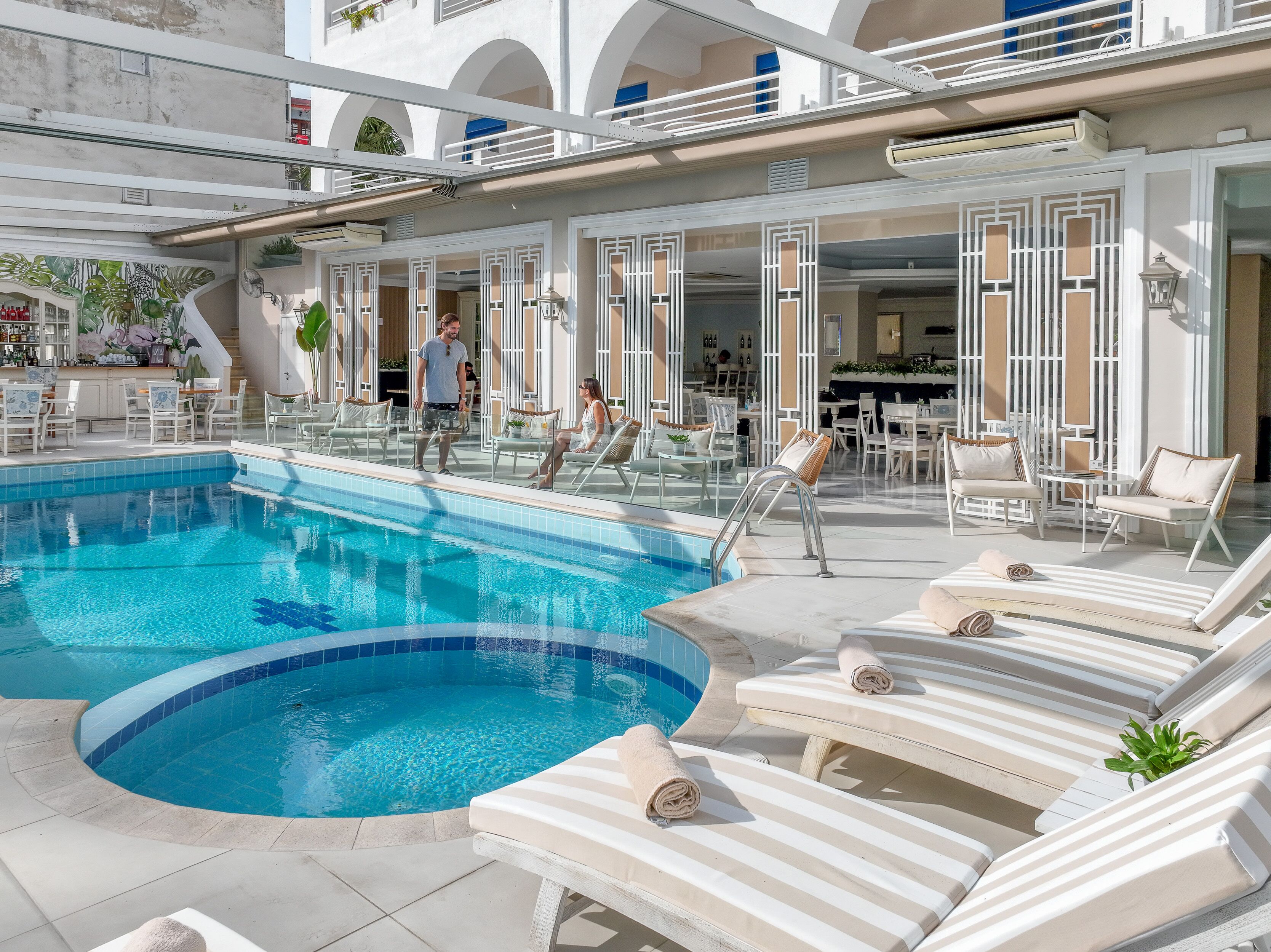 indoor pool, outdoor pool, open 10:00 am to 6:00 pm, pool loungers