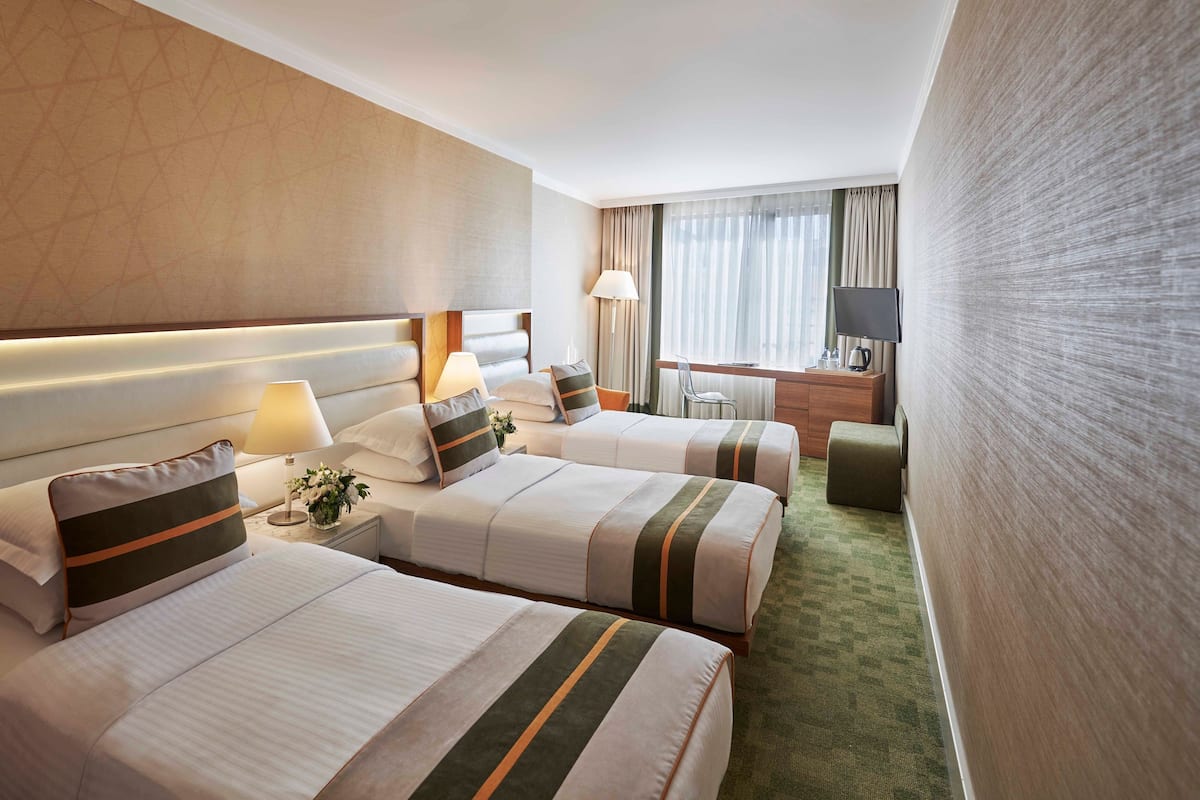 Deluxe Triple Room with Bosphorus View | Minibar, in-room safe, desk, laptop workspace