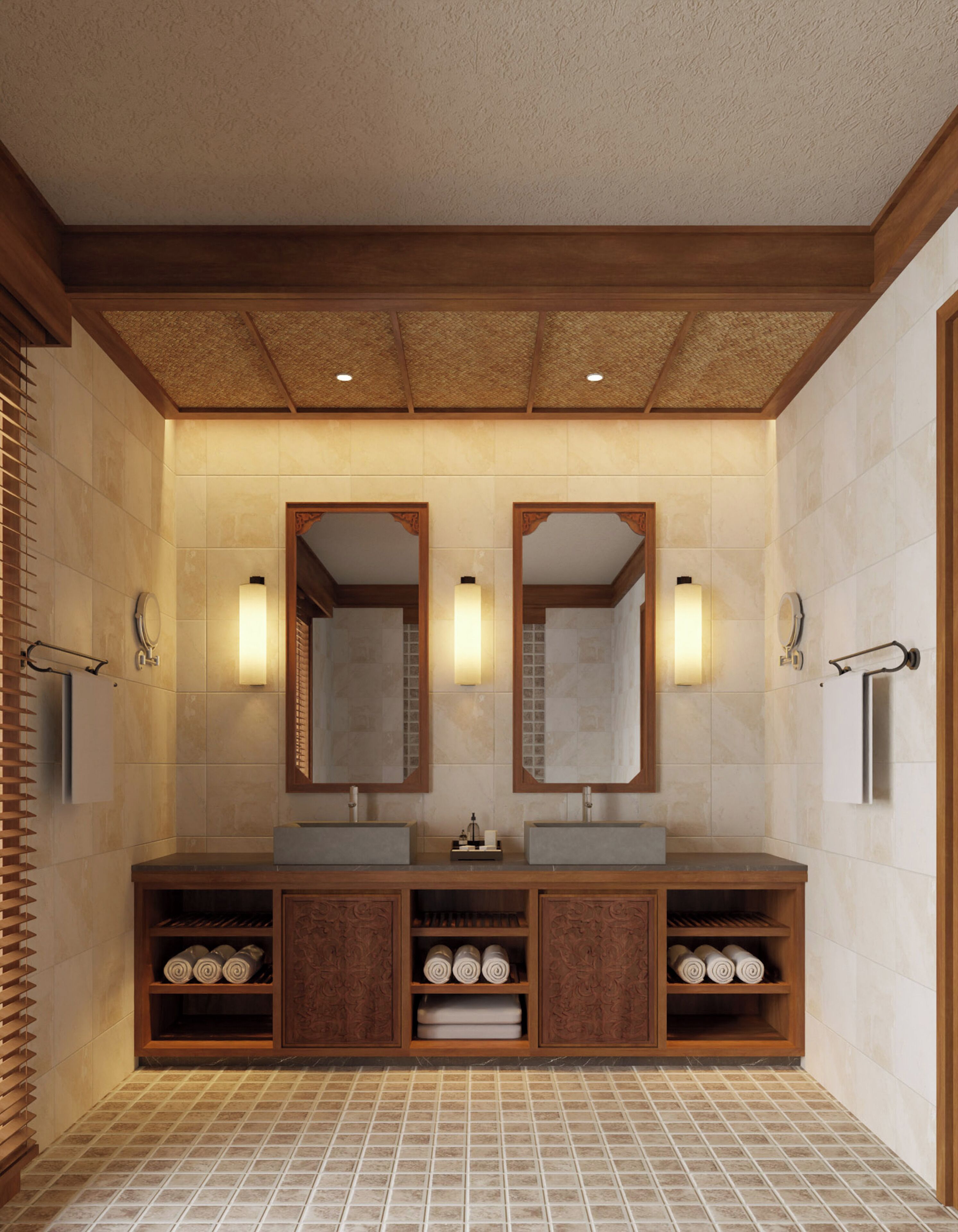 A modern bathroom with two sinks, wooden cabinets, and a large mirror.