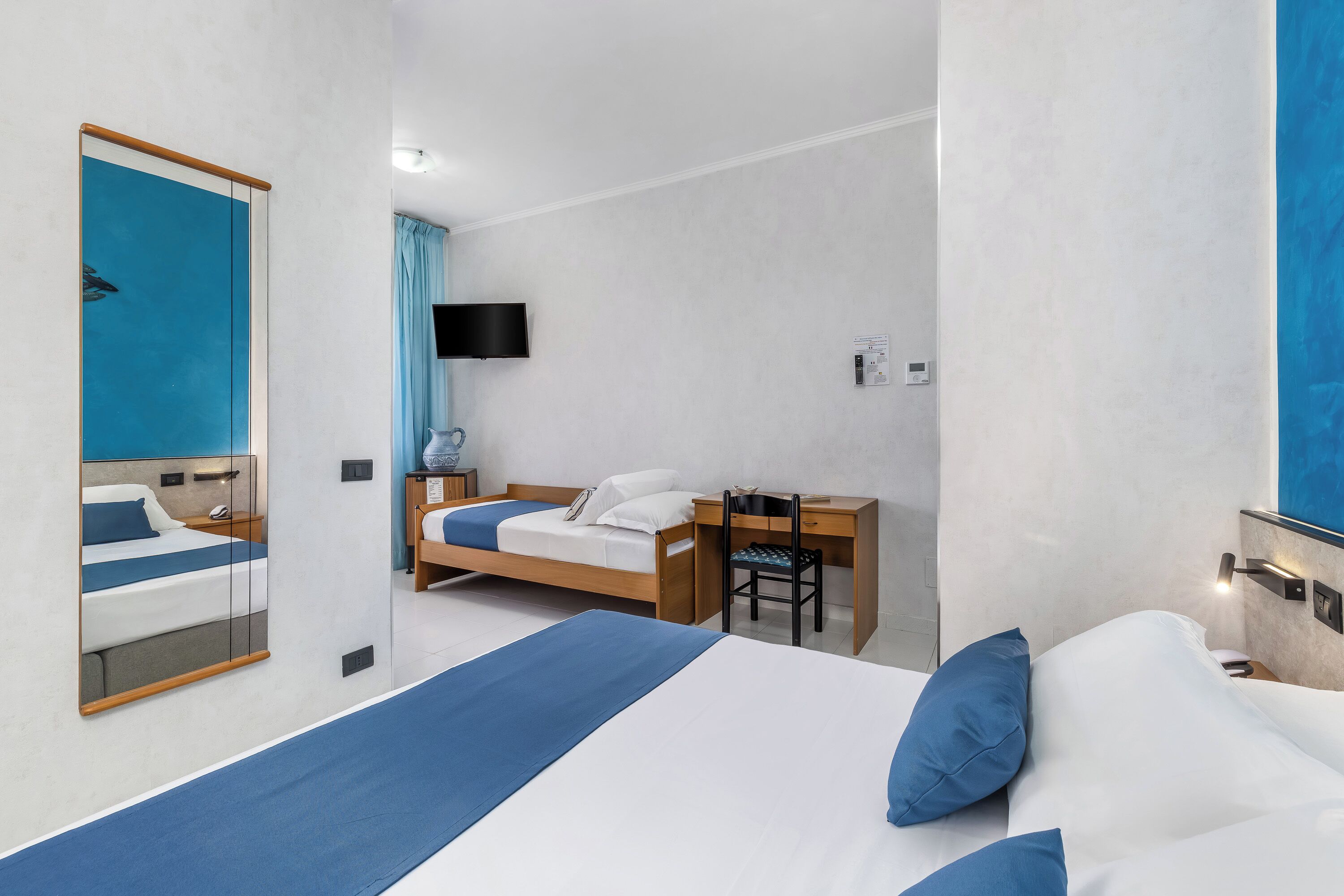 Deluxe Triple Room, Sea View | Minibar, desk, laptop workspace, cribs/infant beds