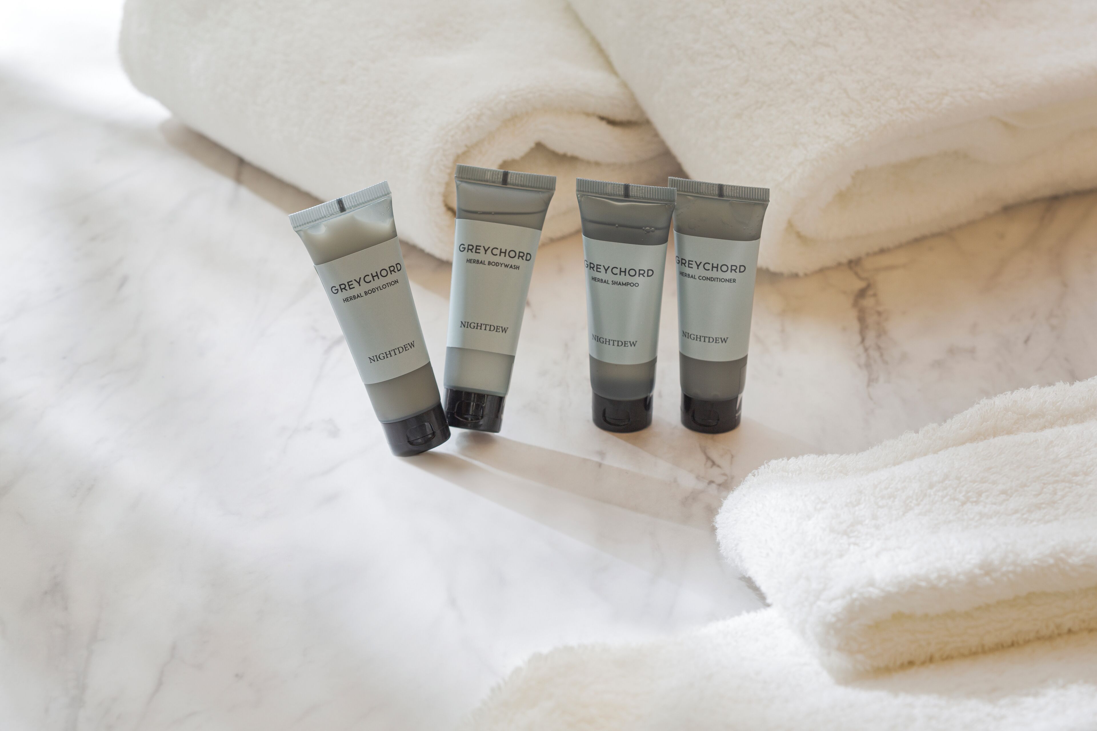 eco-friendly toiletries, hair dryer, slippers, electronic bidet