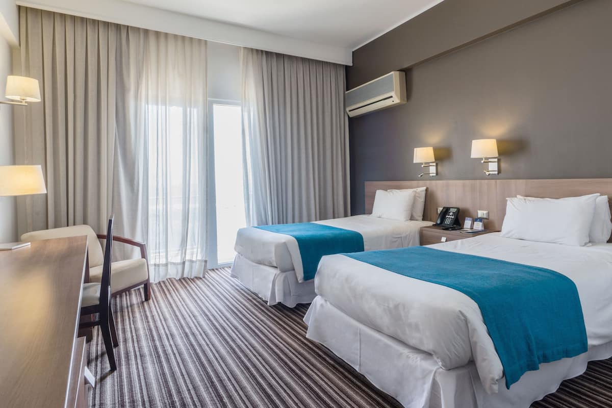 room, 2 single beds, city view | minibar, in-room safe, desk, blackout curtains