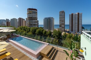 Outdoor pool, pool umbrellas, sun loungers