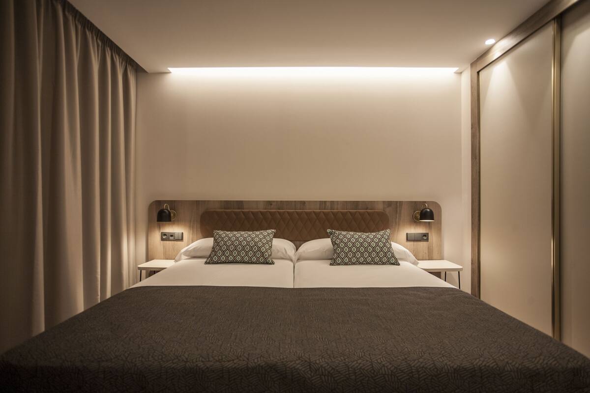 minibar, desk, laptop workspace, blackout curtains