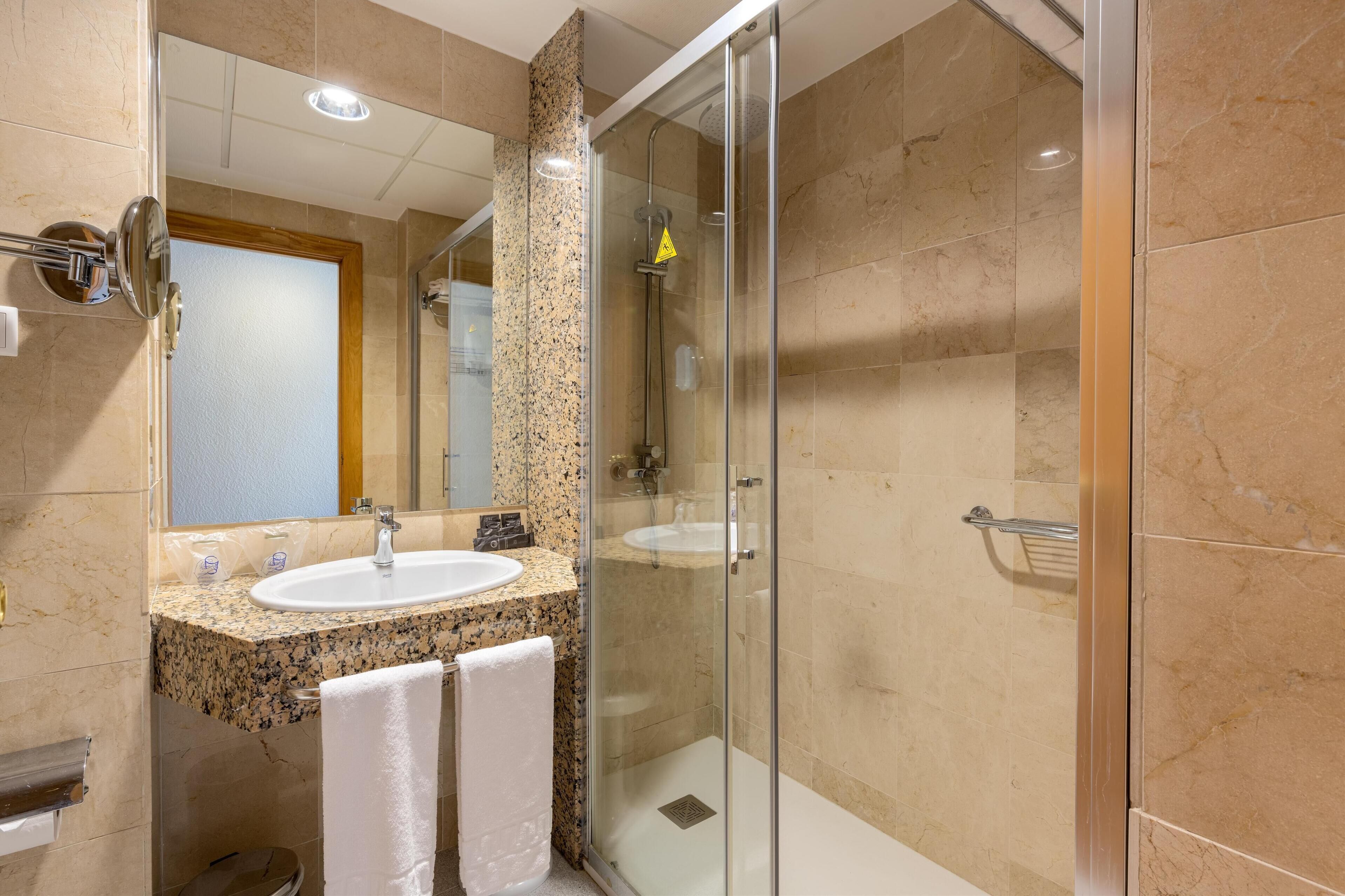 deep-soaking bathtub, free toiletries, hair dryer, towels