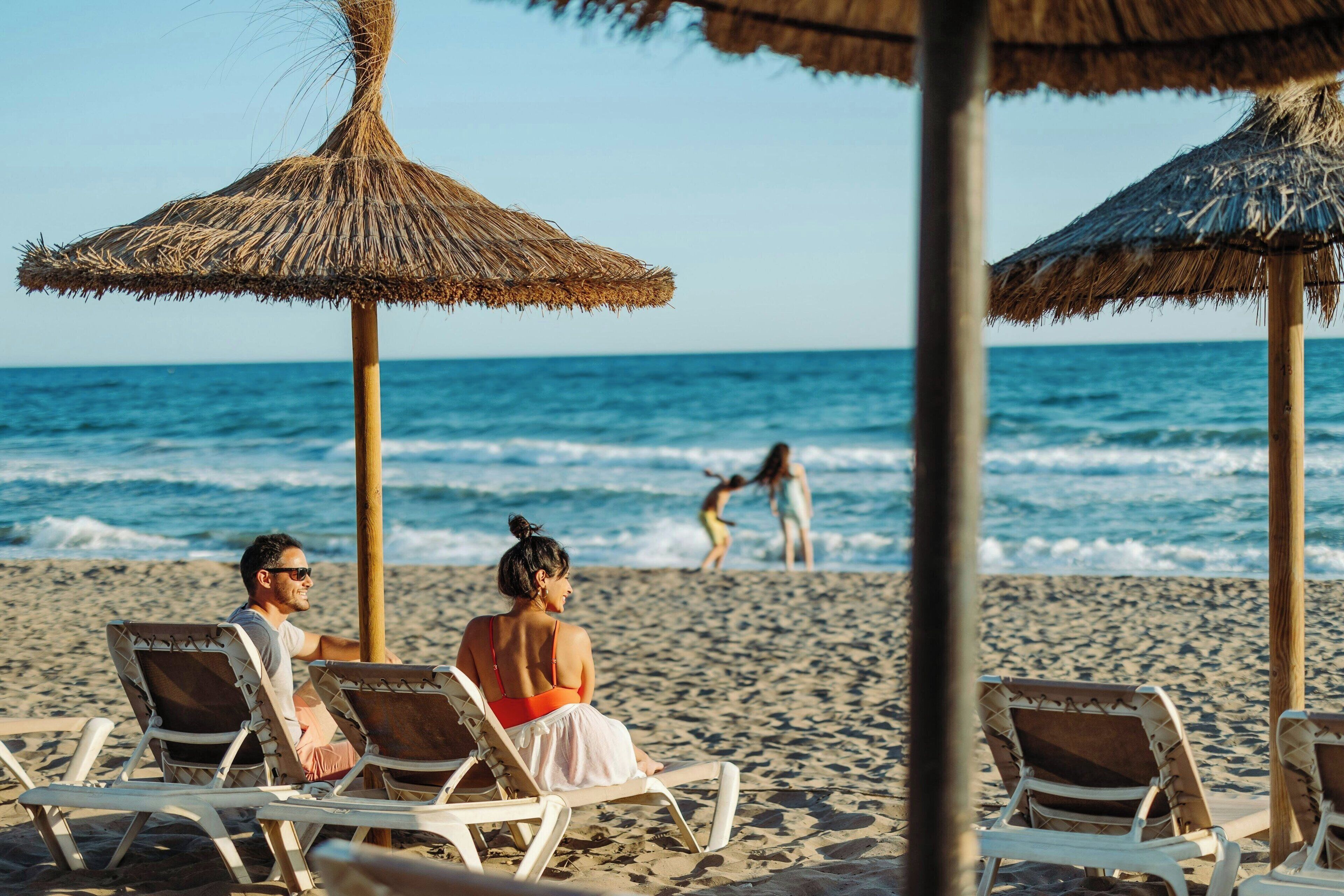 On the beach, beach cabanas, sun loungers, beach umbrellas