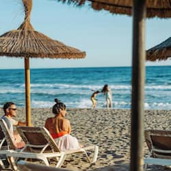 On the beach, beach cabanas, sun loungers, beach umbrellas