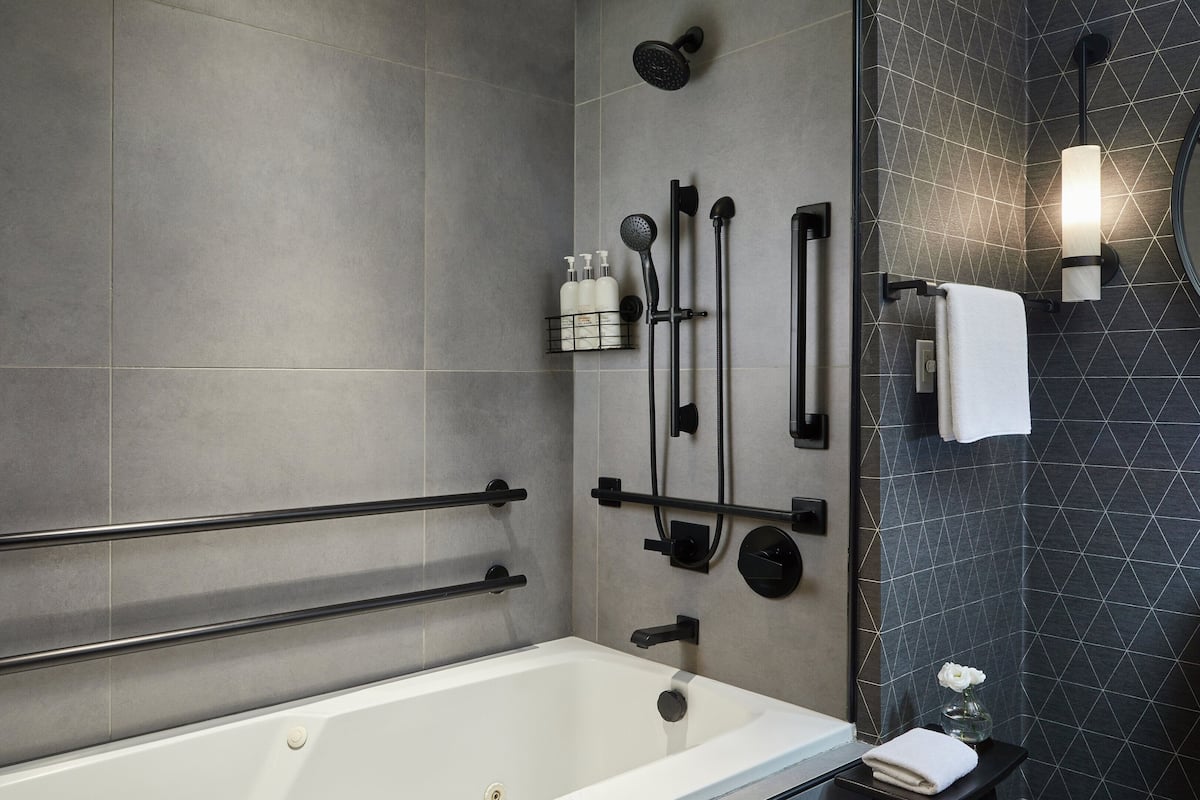 Combined shower/bathtub, designer toiletries, hair dryer, bathrobes