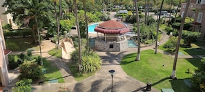 A landscaped area with a gazebo, a swimming pool, and a well-maintained lawn.