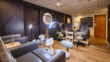 Relax in a stylish room with a seating area, vanity, and ample storage.
