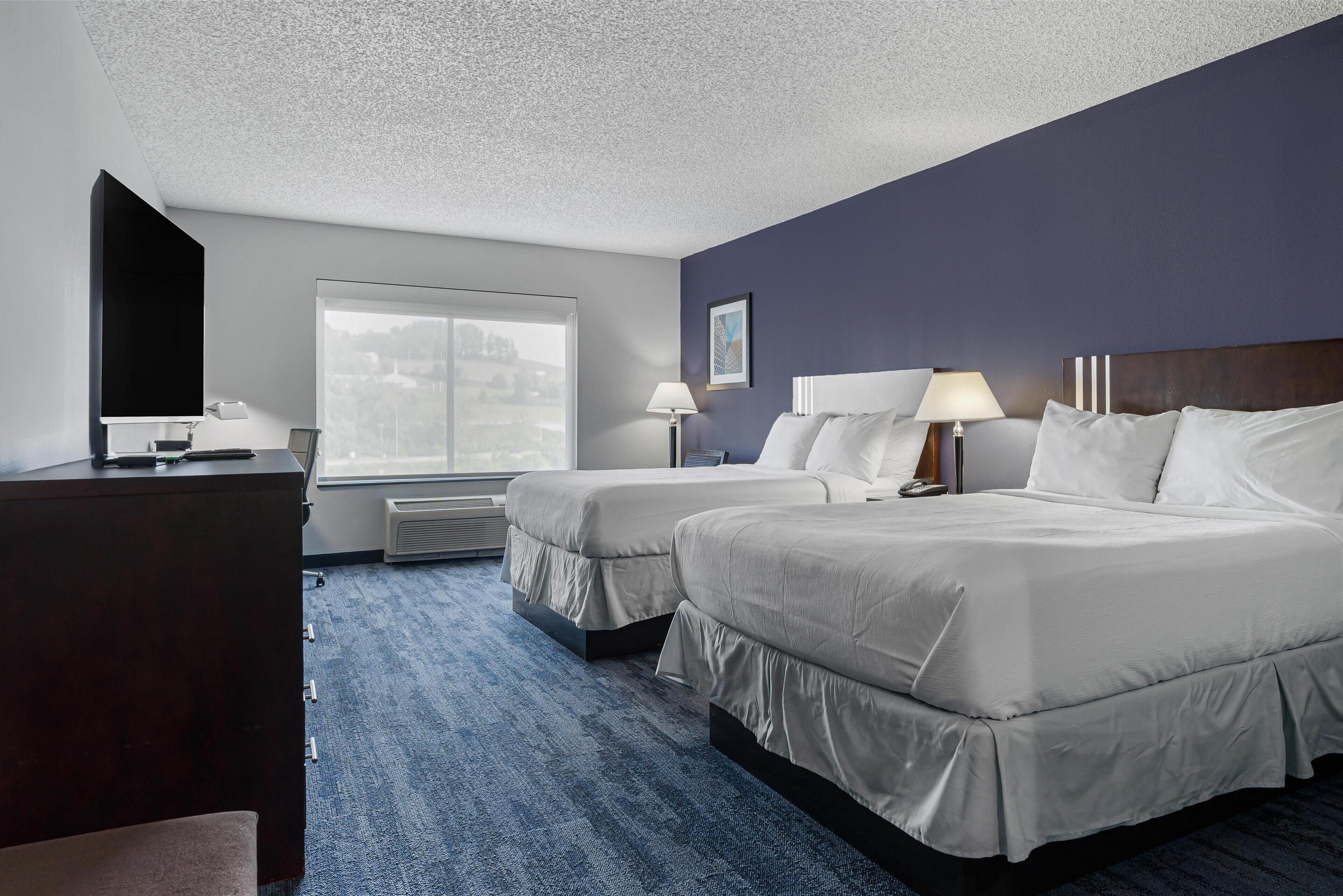 standard room, 2 queen beds, non smoking, refrigerator & microwave | in-room safe, individually decorated, individually furnished, desk