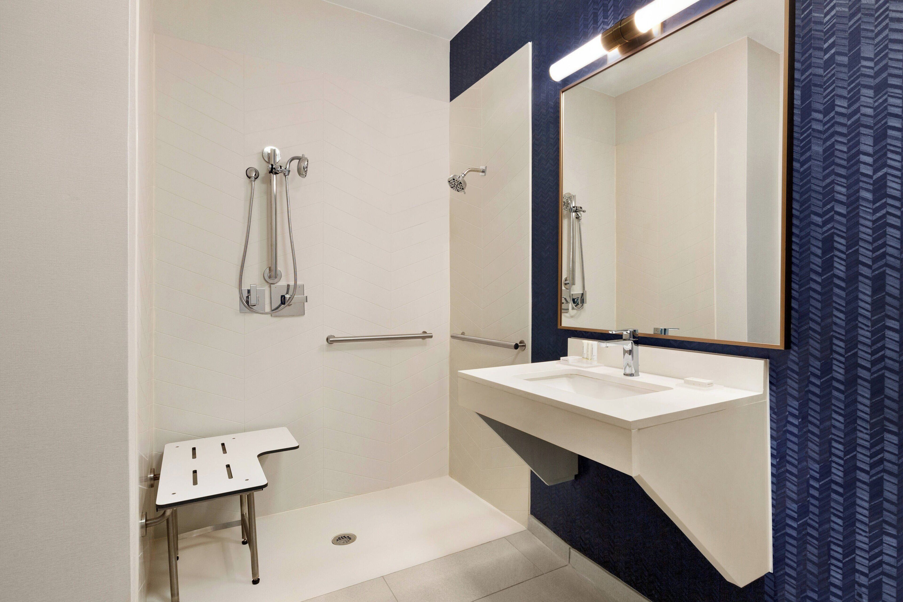 rainfall showerhead, designer toiletries, hair dryer, towels