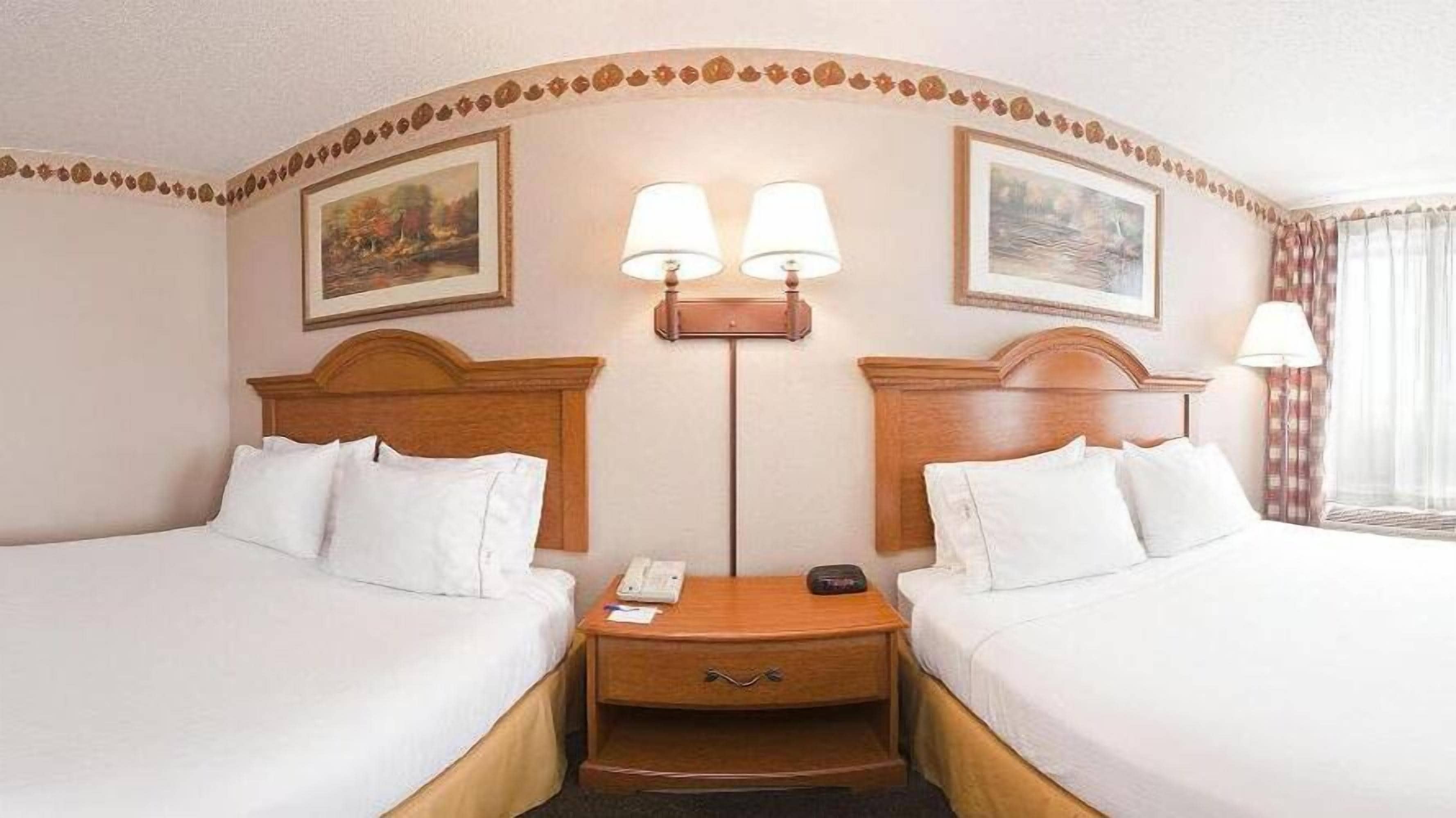 standard room, 2 queen beds | desk, iron/ironing board, free cots/infant beds, rollaway beds