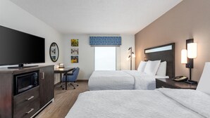 A hotel room with two beds, a desk, a television, and a microwave. - Hampton Inn Akron-South (Akron)