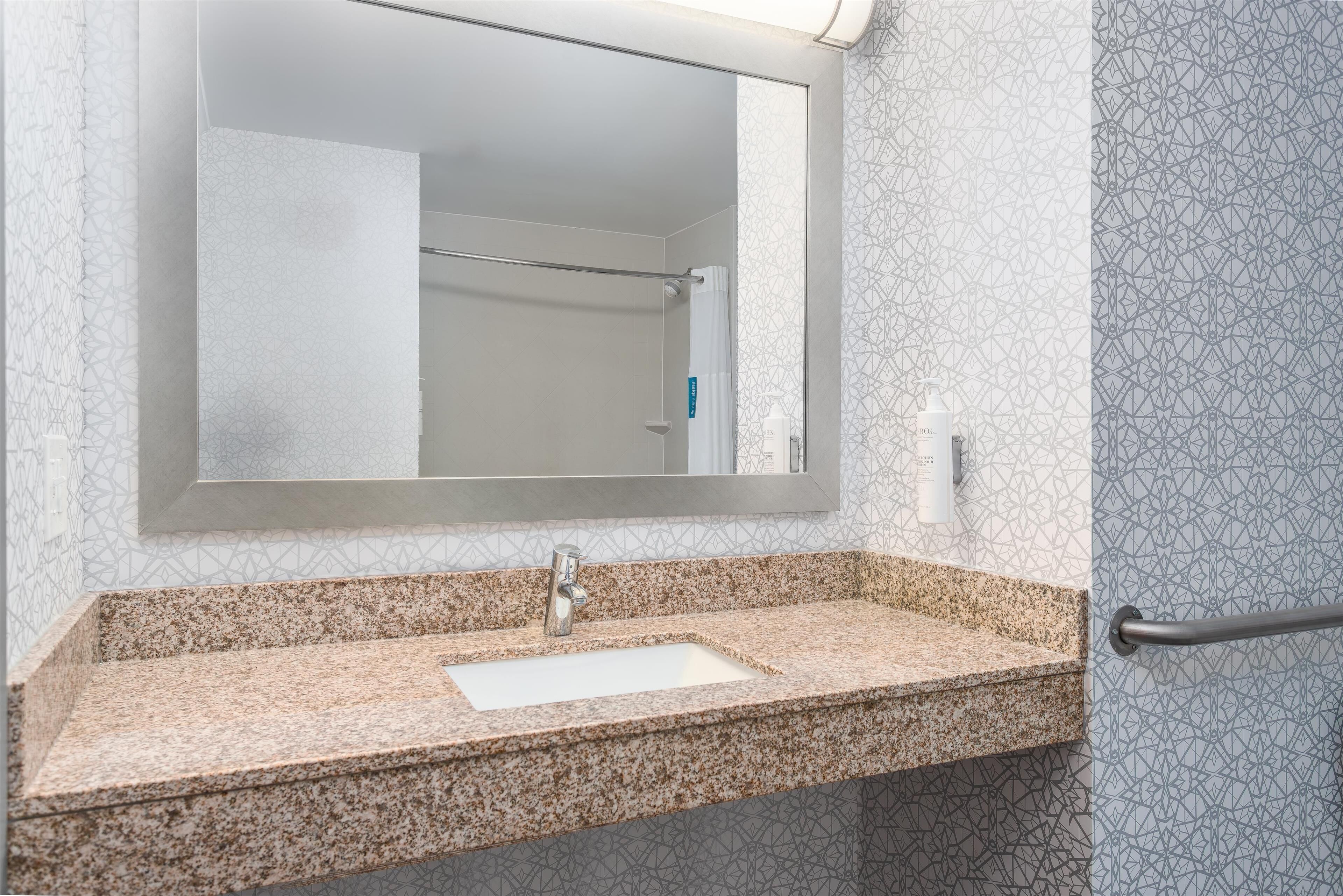 room, 1 king bed, accessible, non smoking | bathroom | designer toiletries, hair dryer, towels, soap