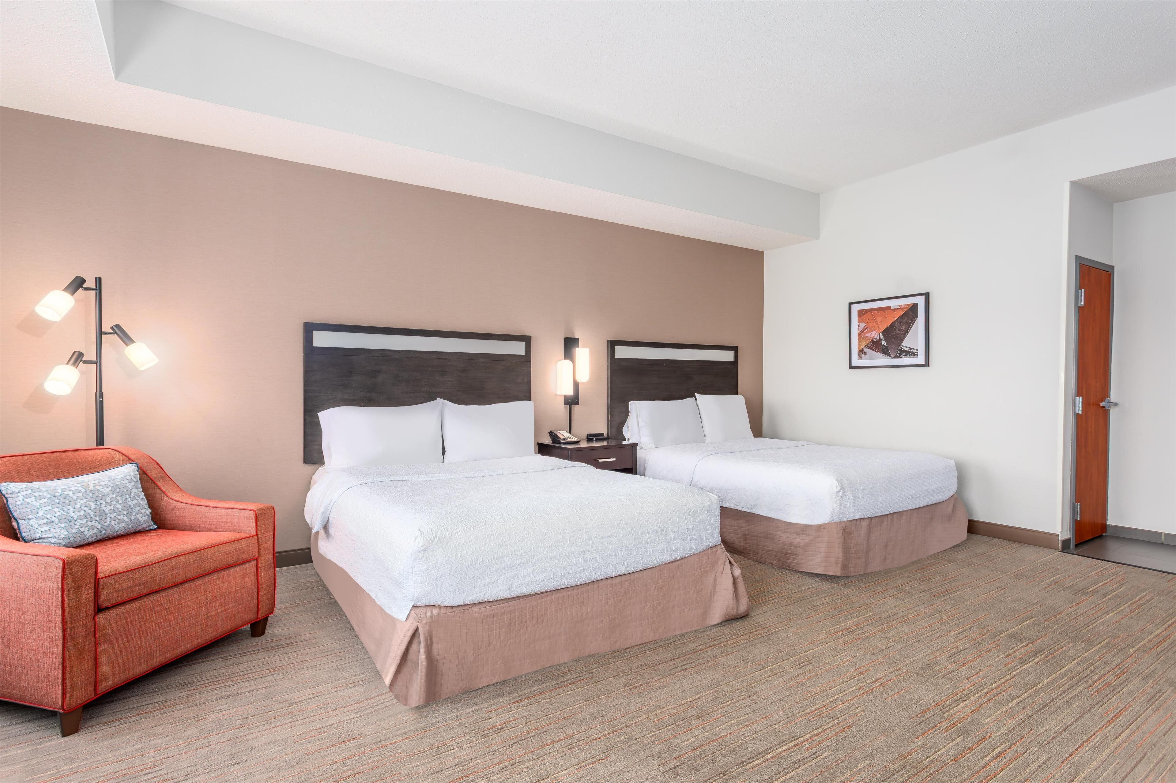 premium bedding, laptop workspace, iron/ironing board