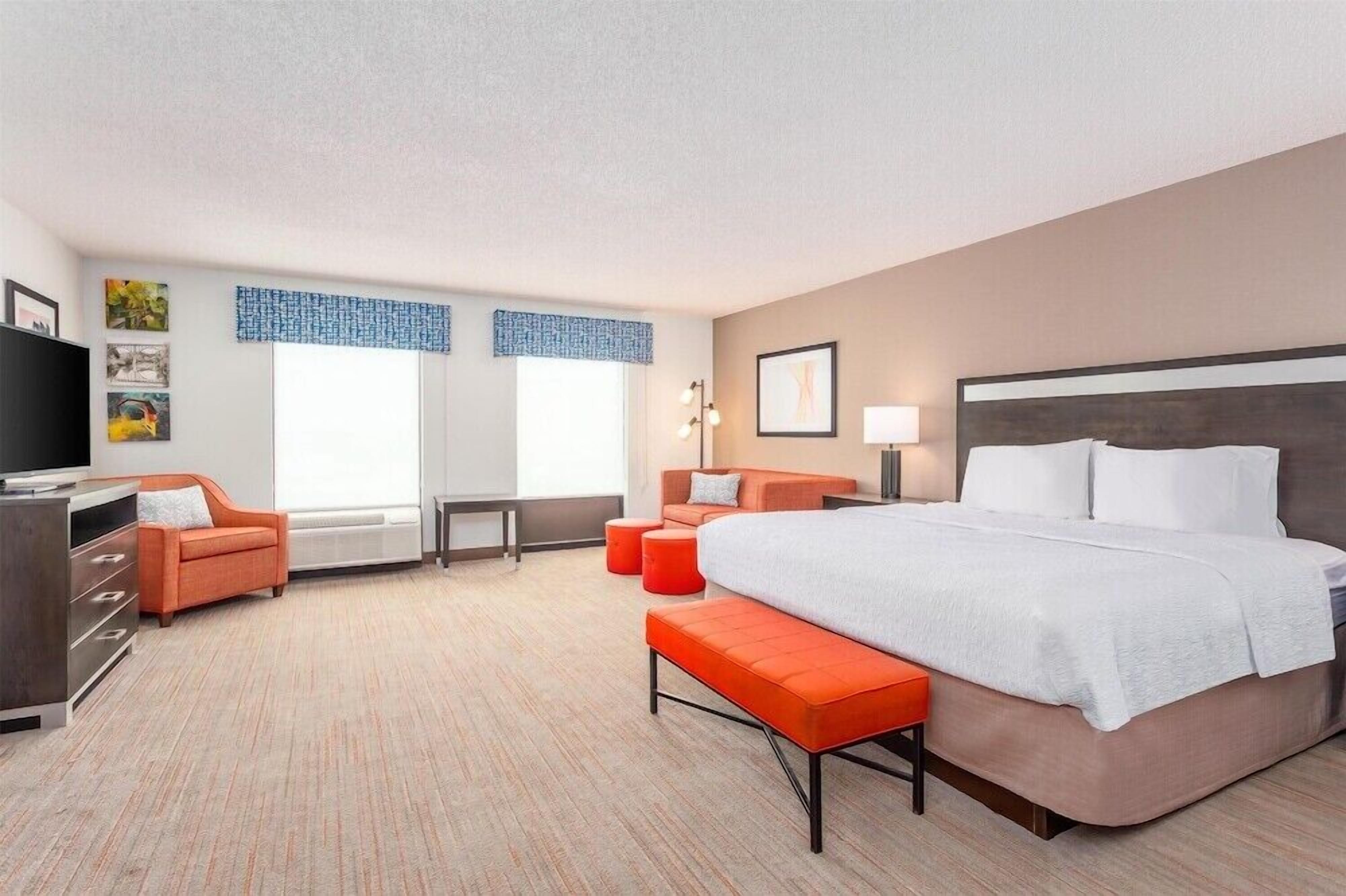 Premium bedding, laptop workspace, iron/ironing board