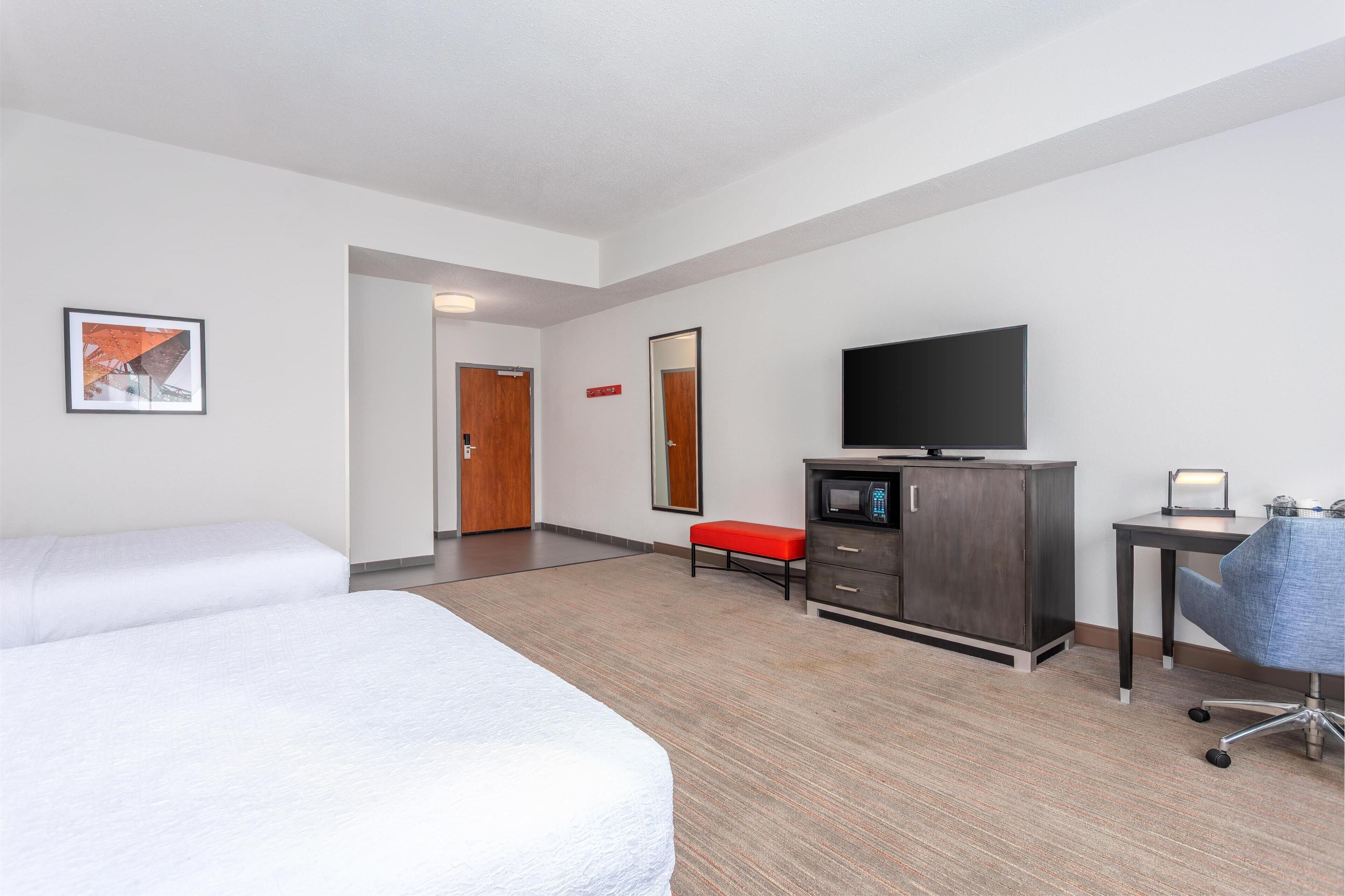 premium bedding, laptop workspace, iron/ironing board