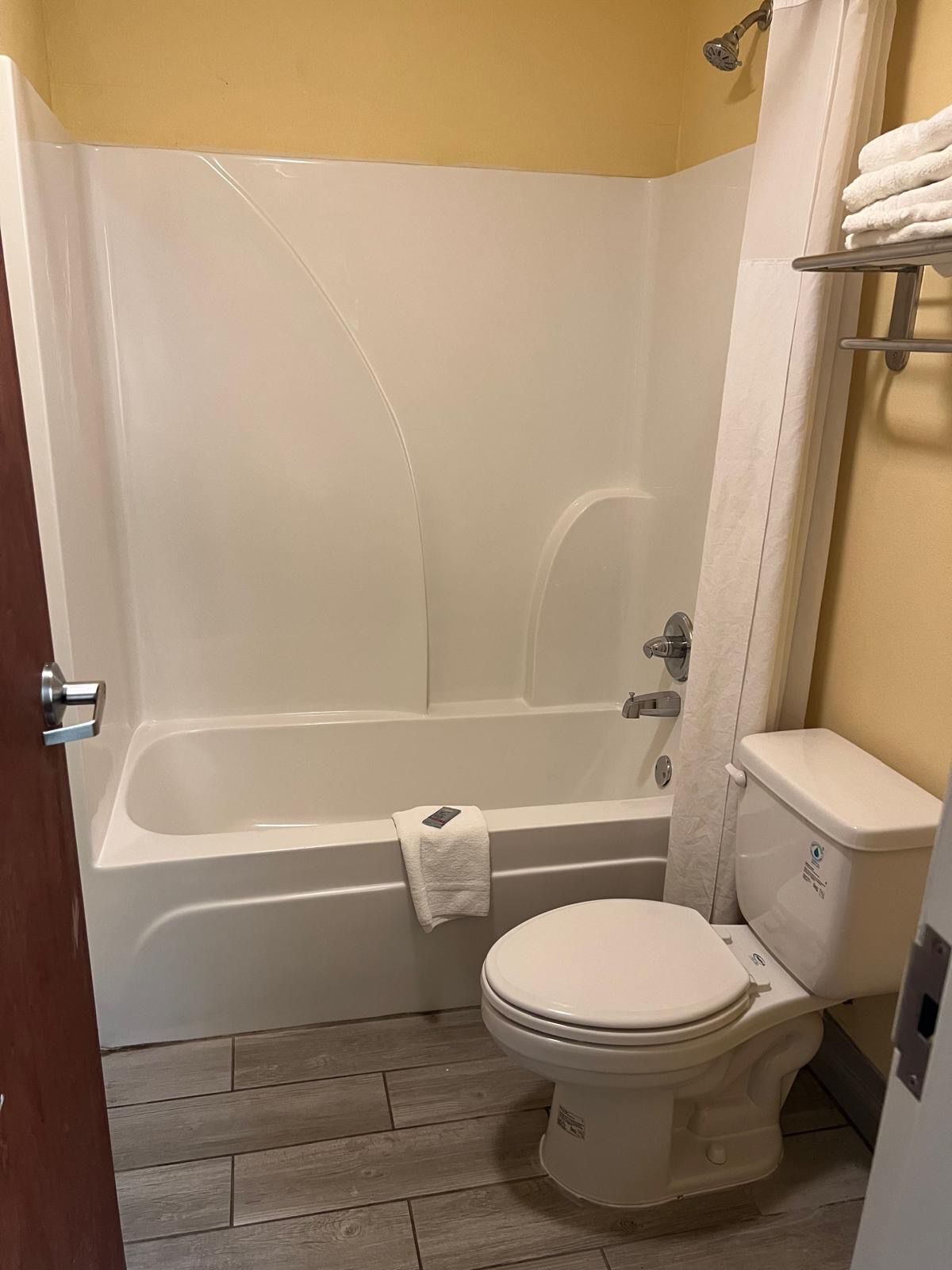 deluxe room, 1 king bed | bathroom | shower, free toiletries, hair dryer, towels