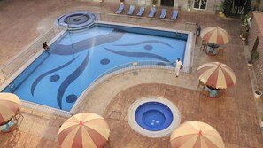 Outdoor pool, open 9:00 AM to 7:00 PM, pool umbrellas, pool loungers