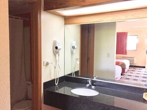 Combined shower/bathtub, hair dryer, towels, soap