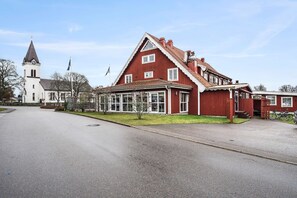 Stunning two-story building with a gabled roof and charming porch area.