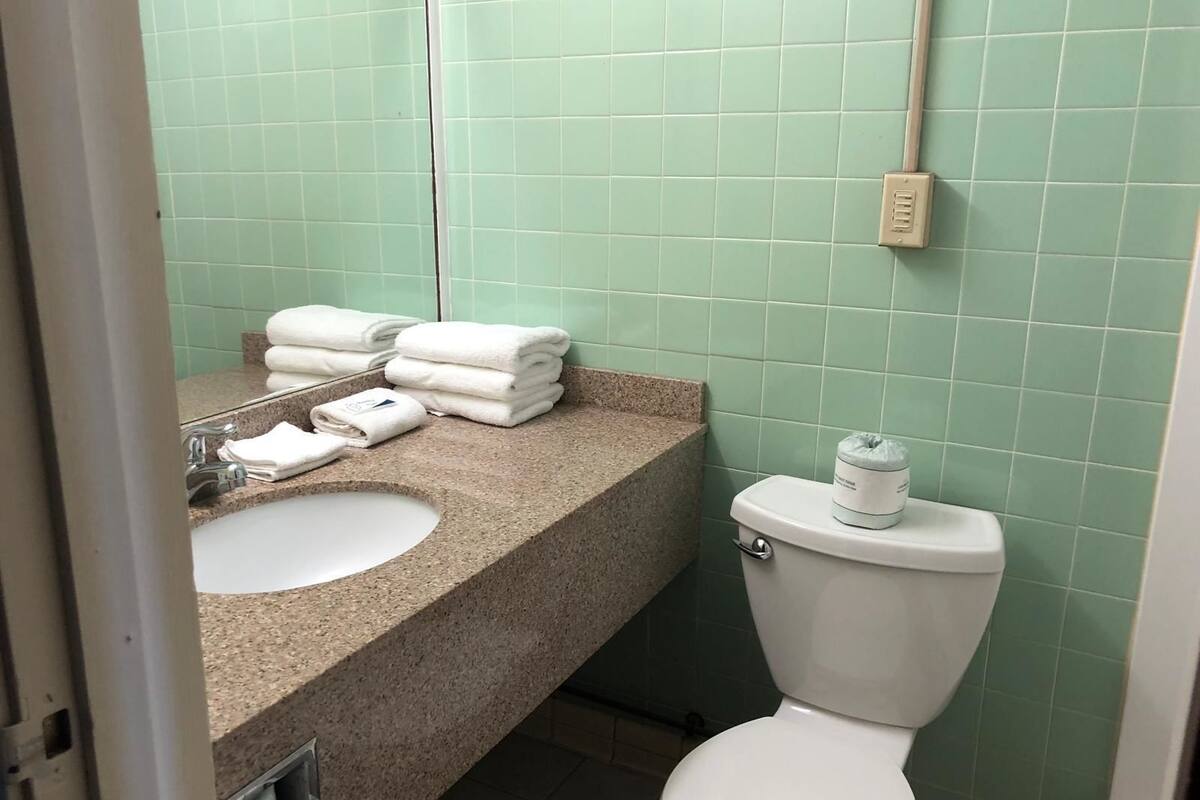 standard room, 1 king bed | bathroom | hair dryer, towels