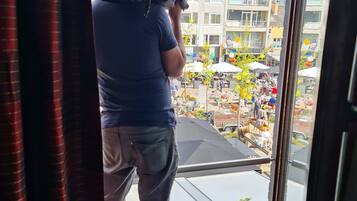 Enjoy the vibrant street scene from the comfort of your room.