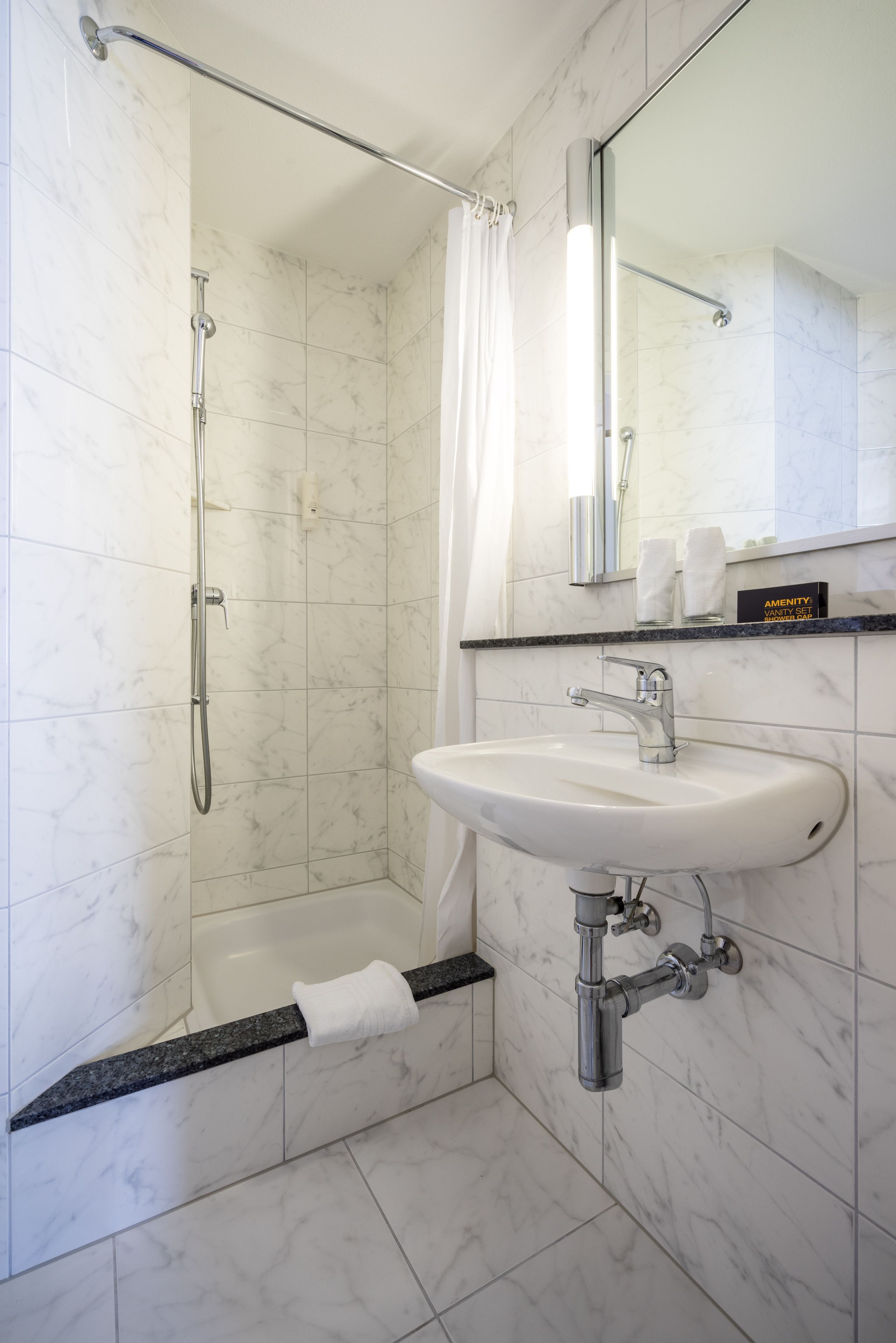 standard twin room | bathroom | free toiletries, hair dryer, towels, soap