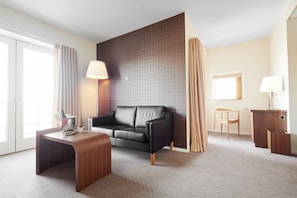 Junior Suite, Jetted Tub | Desk, laptop workspace, blackout drapes, iron/ironing board