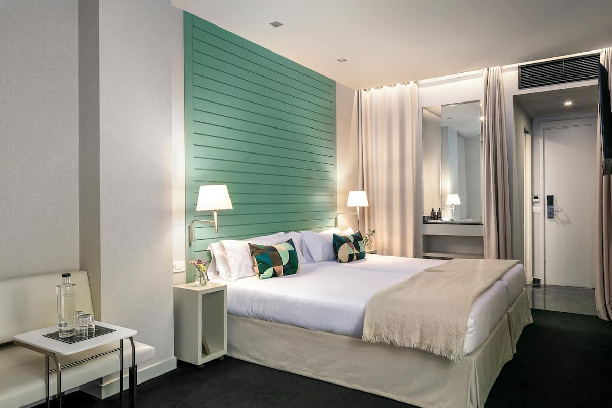 Egyptian cotton sheets, down duvets, memory-foam beds, minibar