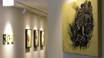 A gallery with artworks on display.