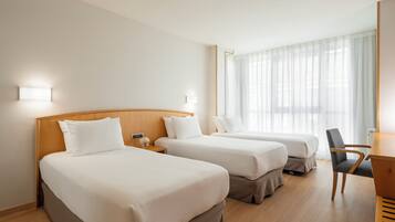 Triple Room | Minibar, desk, blackout drapes, free WiFi