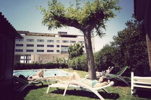 Seasonal outdoor pool, pool loungers