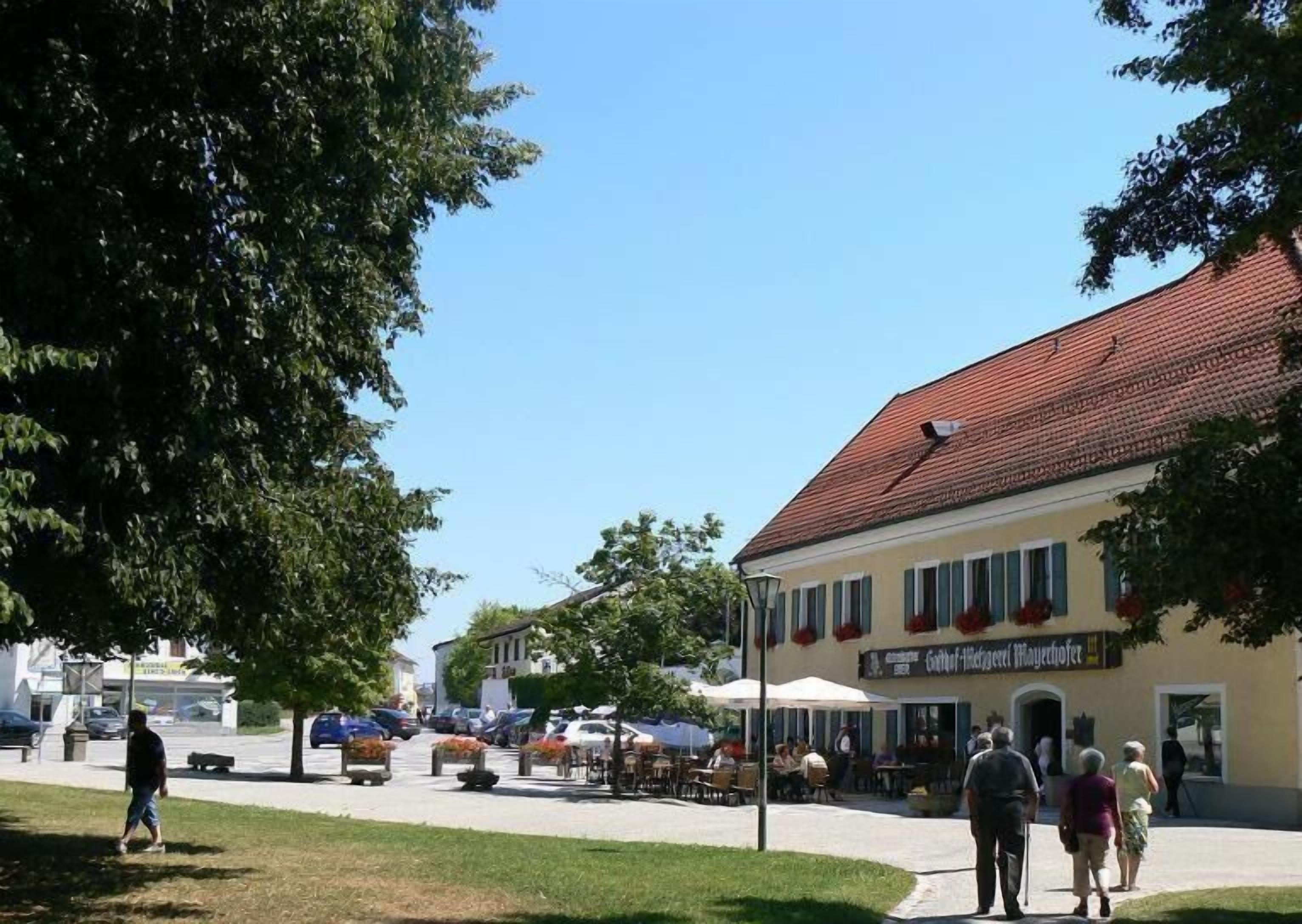 A building with a red-tiled roof and a sign that reads "Hotel-restaurant Imbiss".