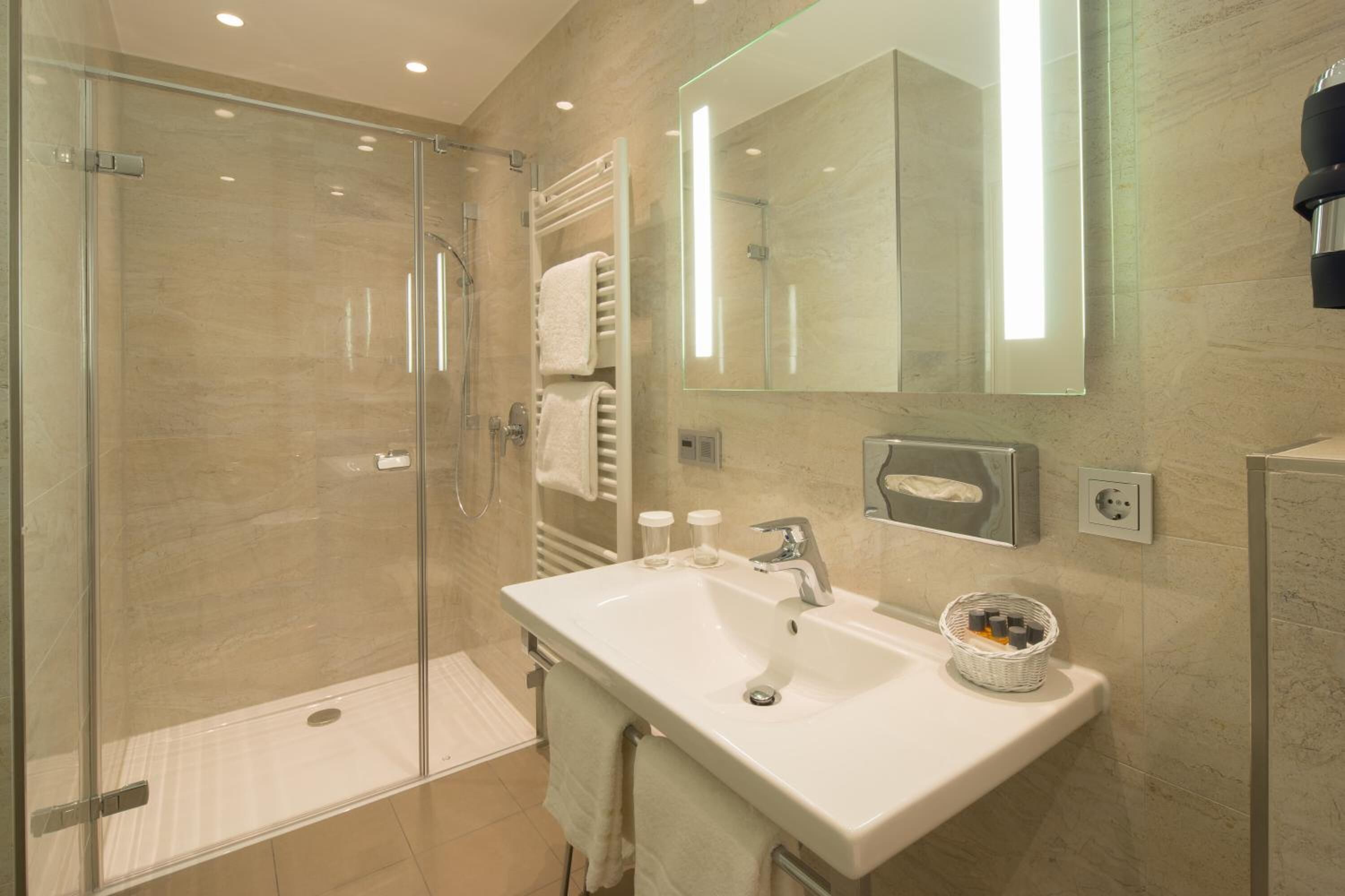 shower, free toiletries, hair dryer, towels