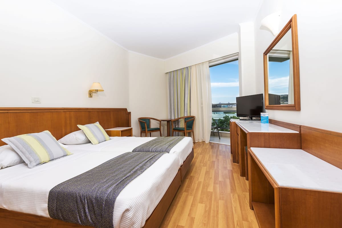 double room, partial sea view | premium bedding, in-room safe, blackout curtains, iron/ironing board