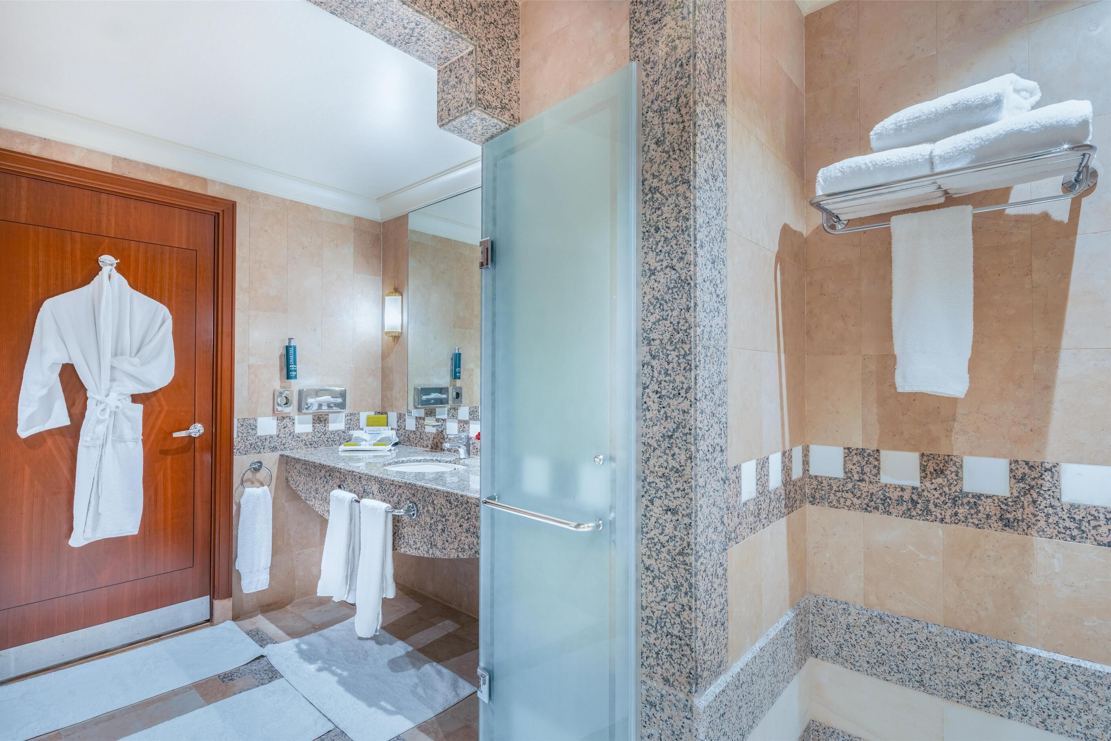 presidential room, ensuite | bathroom | combined shower/bathtub, hair dryer, slippers, towels
