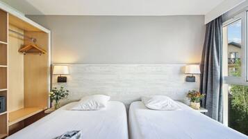 Luxe beddengoed, een kluis op de kamer, geluiddichte muren