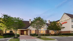 A two-story hotel with a brick facade, a covered entrance, and a sign indicating it is a Marriott Residence Inn. - Residence Inn by Marriott Houston Northwest/Willowbrook. (Houston)