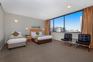 Standard Deluxe Room | Minibar, in-room safe, desk, soundproofing
