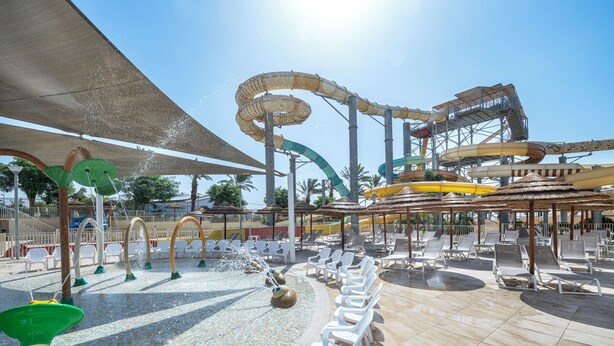 A water park with a lazy river, water slides, and lounge chairs. - U Splash Resort Hotel Eilat (Hevel Eilot)